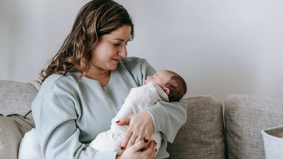 Mum with new baby at home