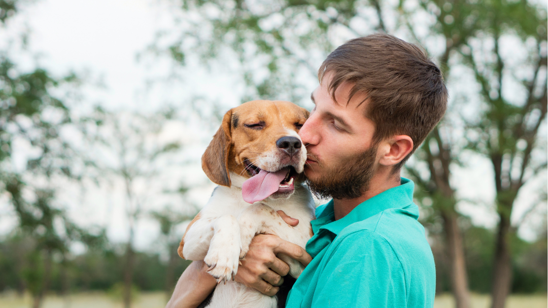 A man hugging his dog