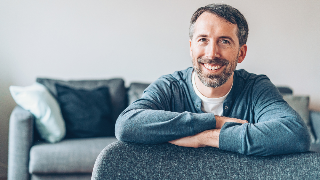 man sitting on couch